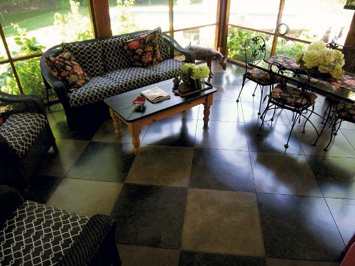 Living room floor of concrete in a checkerboard pattern.