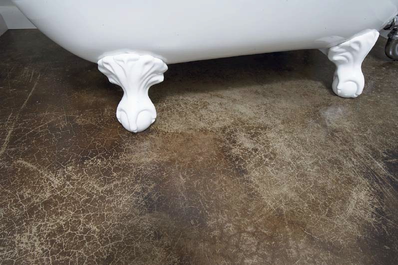Bathroom floor with acid stain as a durable concrete floor covering.