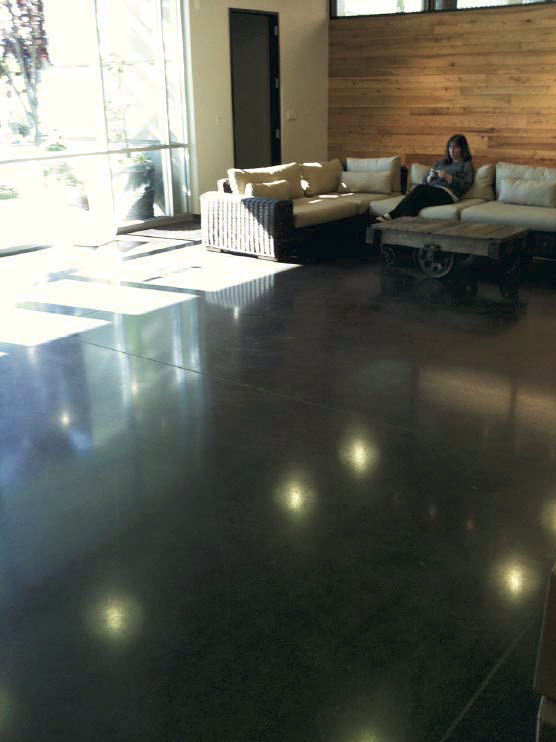 Polished concrete in a lounge area with a high gloss.