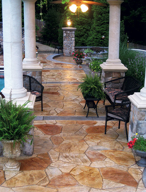 Greystone masonry created a tropical oasis in a South Caroline backyard using precast concrete stones.