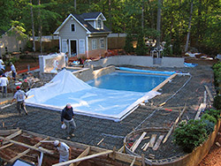 Crews had to cautiously work around more than a mile of plumbing and electric when pouring the pool deck.