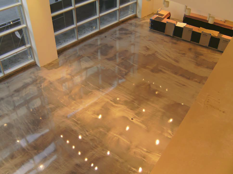 Ruiz says the floor's marbled look, which installers achieved by mixing BDC Decorative Concrete Supply's Shimmer pigment into epoxy material, adds texture and depth to the surface.