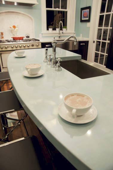 A light blue kitchen countertop gives this space a homey feel.