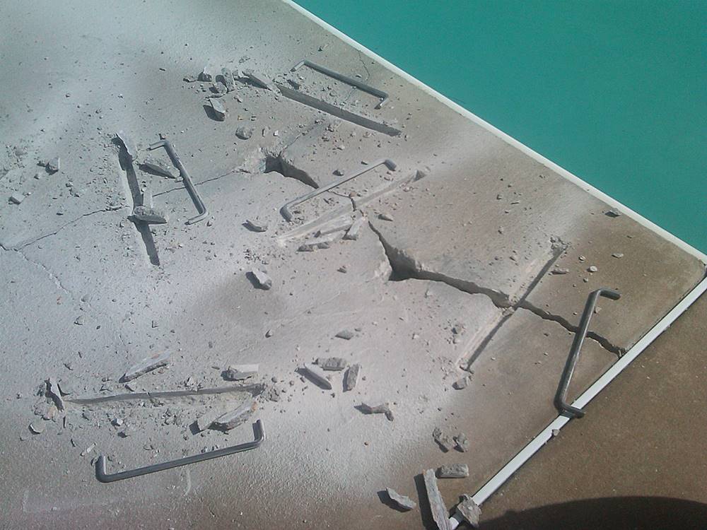 Use of The Concrete Staple on a pool deck prior to an overlay installation to repair cracked concrete