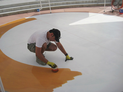 Having worked with FLOORmap on several previous projects, Perez was familiar with Bruces ability to translate designs. In particular, he likes the quality of her stencils adhesive, which he says does not leave a residue and is not so aggressive that it pulls up the previously applied colors from the concrete. 