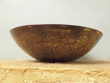 Bowl on a concrete countertop in a show room.