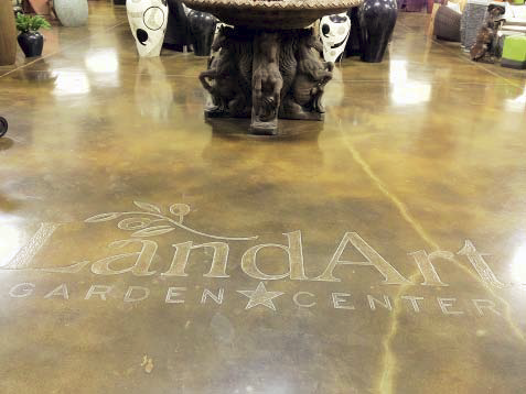 Land Art logo on a concrete floor in Garden Center