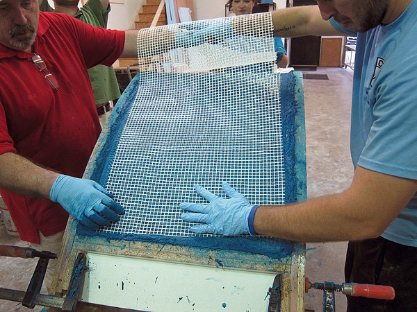 laying glass scrim on mold