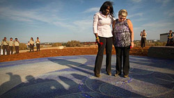 Milena Sellers-Phillips (left) and Maria Keever at the dedication of the memorial to their slain sons.