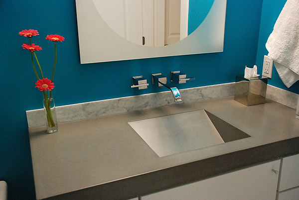 Dimensional sink shape in concrete countertop. The variety of sink shapes you can make with concrete blows away what can be done with granite and marble