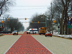 Roadway integrally colored and stamped in a herringbone brick pattern