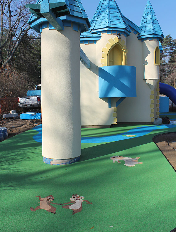 TPV rubber kids play area - One of the more whimsical projects John Schroeter, of Toronto, Ontario, has done involves a childrens castle, complete with precast cartoon characters made from colorful TPV. The TPV floor inside looks like cobblestone. Photo courtesy of Ideal Surfacing