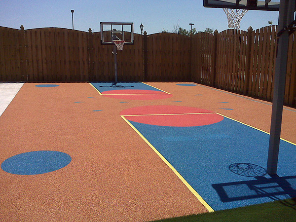 Designed for youngsters in a Virginia daycare facility, this flexible TPV-coated basketball court reduces the possibility of injuries from falls. Photo courtesy of American Recycling Center Inc.