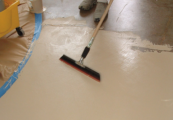 Using a squeegee for concrete coatings