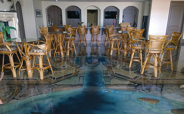 A 3-D painted concrete fish pond the apparent depth of the water is a result of the many layers of blue color applied
