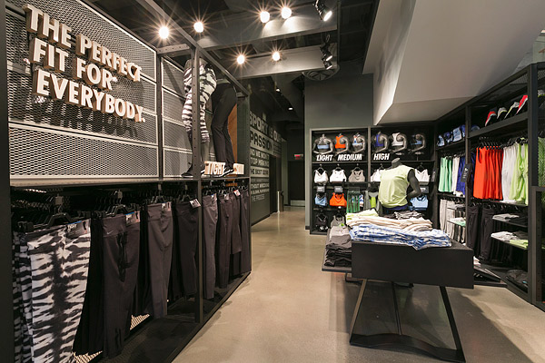 Polished aggregate floor - Concrete Decor magazine - At the new Nike Running store at The Grove in Los Angeles, a polished concrete overlay was chosen to help produce the brand impression sought by Nike and architect McCall Design Group of San Francisco.