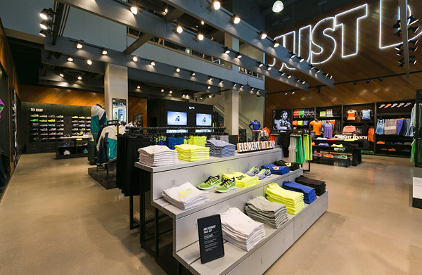 Polished aggregate floor - Concrete Decor magazine - The owners of the Nike store sought to produce a field-house vibe with the design of the store, says Dennis Wu, project architect for McCall Design Group.