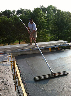 Pouring a concrete balcony and stamping the concrete on the second floor.
