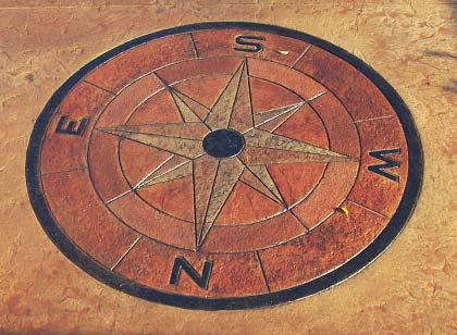 Stained concrete compass rose.