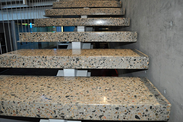 Designers are still drawn to natural concrete finishes, such as polished concrete with exposed large aggregate