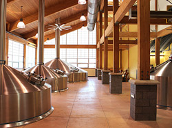  Overall, the brewery work has involved acid-stained floors, integrally colored concrete (above) and epoxied floors, concrete countertops, and a stamped wood-plank concrete patio and sidewalk leading to a beer garden.