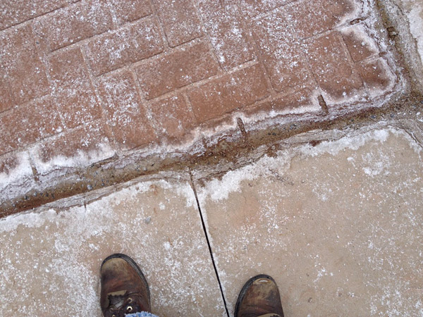 Deicers damage concrete - Water from freeze-thaw cycles and damage from de-icers have weakened a joint and deteriorated the concrete.