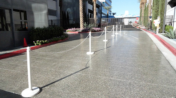 polyurethane sealed concrete - The guard gate area of Panorama Towers features concrete that was ground, honed and sealed with a polyurethane. Prior to this, the area had been stamped concrete.