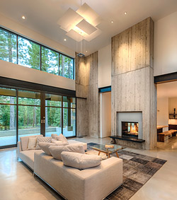 precast concrete fireplace surround and wall above in a high ceiling living room by Jimmy Hazel of Clastic Designs in Reno