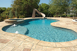 Inviting swimming pool with a stamped concrete deck surround