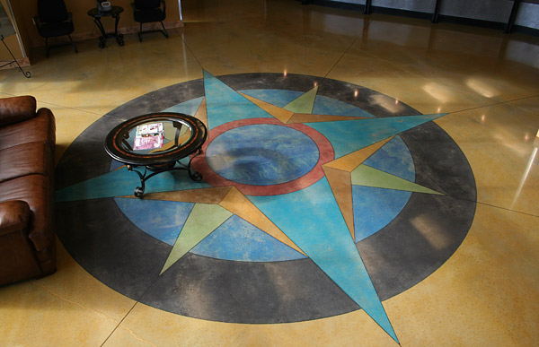 colorful concrete compass rose on yellow floor