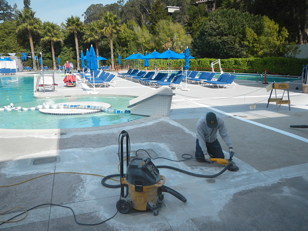 repairing a pool deck with a machine