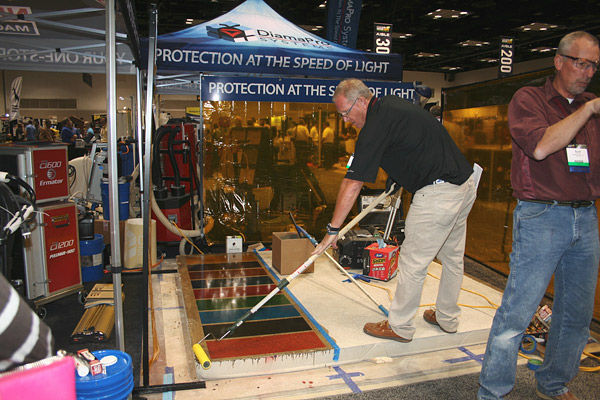 Coating specialist Scott Thome demonstrates the ease of rolling on DiamaPro UVHS at the 2015 Concrete Decor Show.