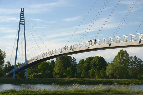 cable-stayed foot bridge with gorgeous sky and river view