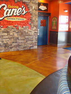 two tone floor with brick wall