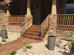 brown concrete entryway and stairs