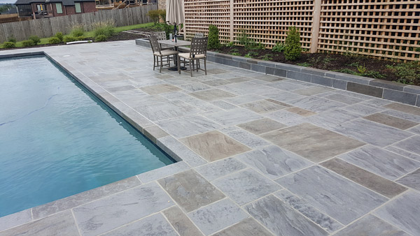 slate pool deck with natural looking architectural concrete