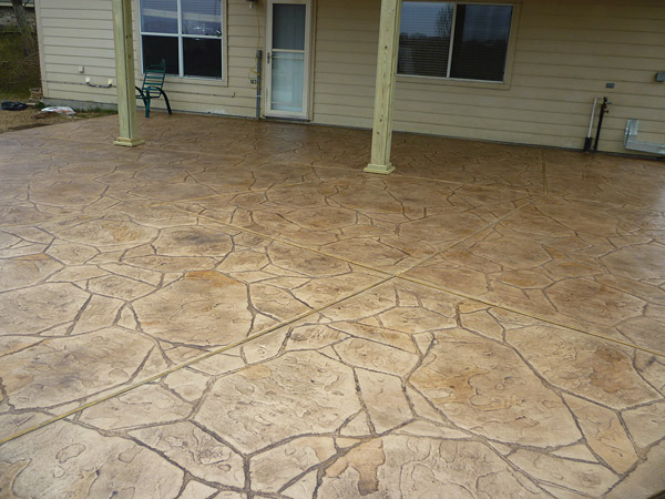 covered stamped concrete patio with control joint