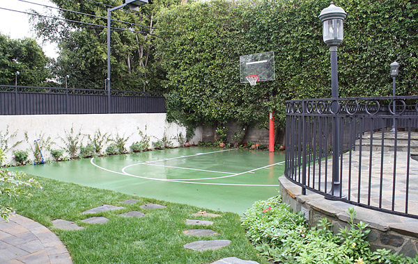 basketball court with greenery around
