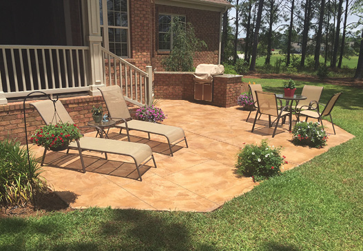 Inviting stamped concrete patio with furniture