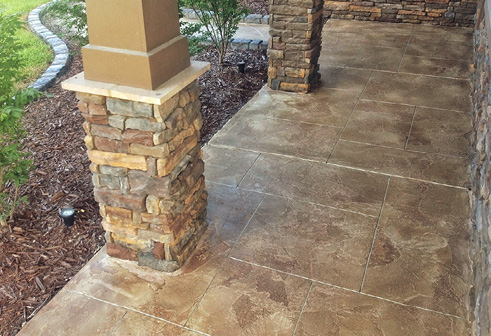 Rustic hues on a stamped concrete covered walkway.
