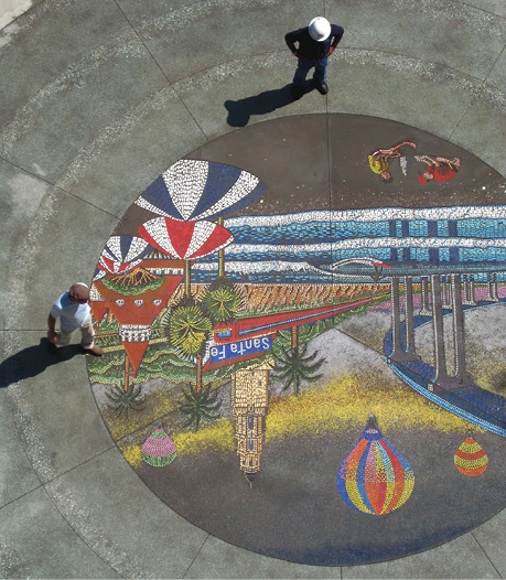 At the front entry plaza of the North Island Credit Union headquarters in Kearny Mesa, theres a 20 foot in diameter LithoMosaic designed by artist Wick Alexander and installed by T.B. Penick & Sons.