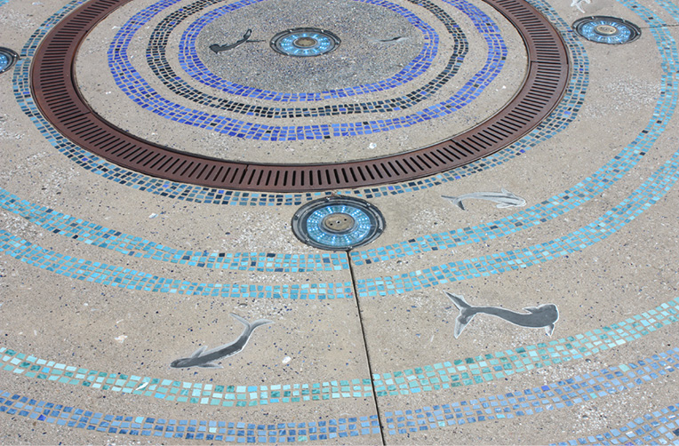 A plaza at the Del Mar Highlands Town Center in San Diego features a LithoMosaic incorporated into a fountain where artist Christie Beniston used more than 20 different blue and green mosaic tiles.