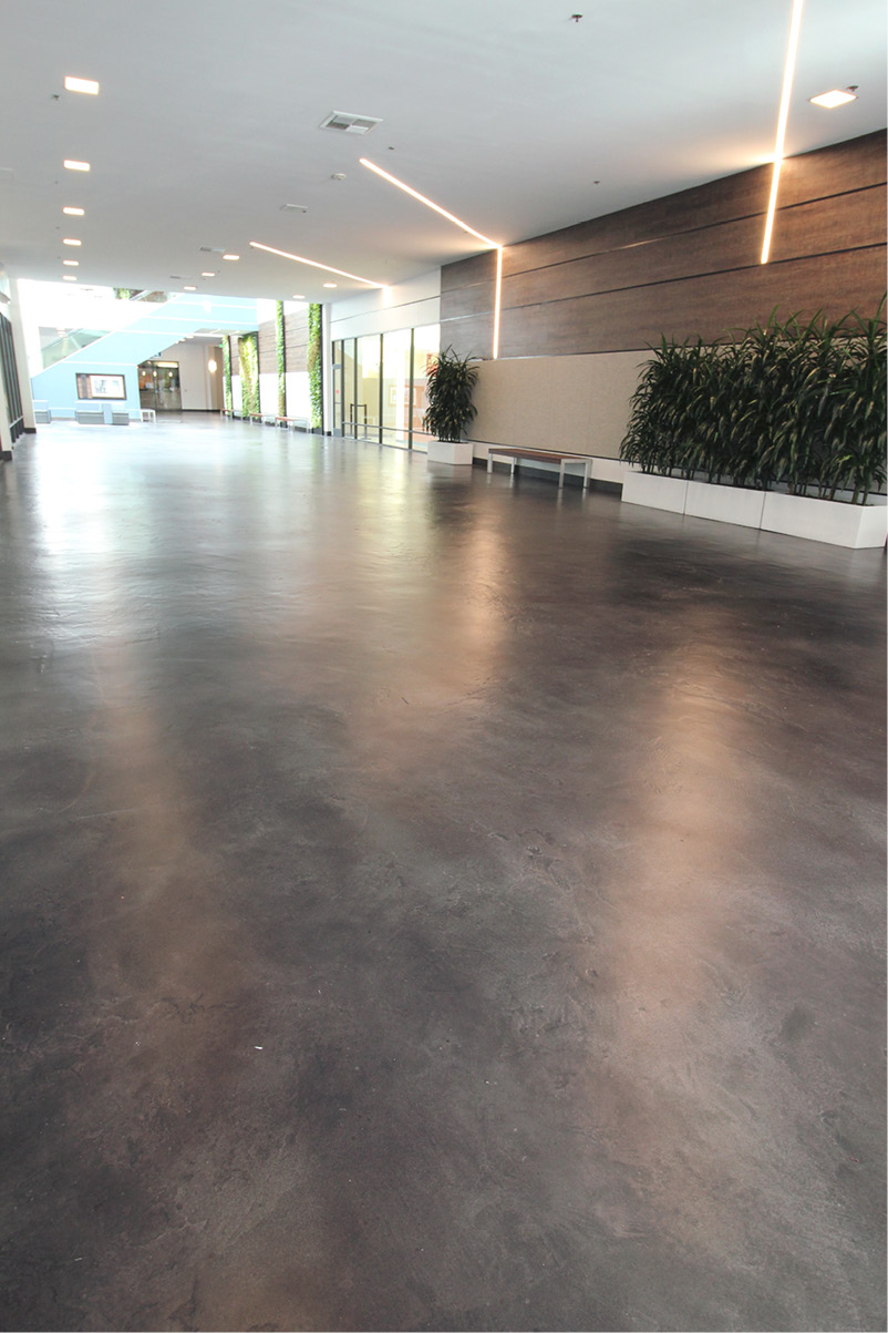 grey concrete floor in front of shopping center