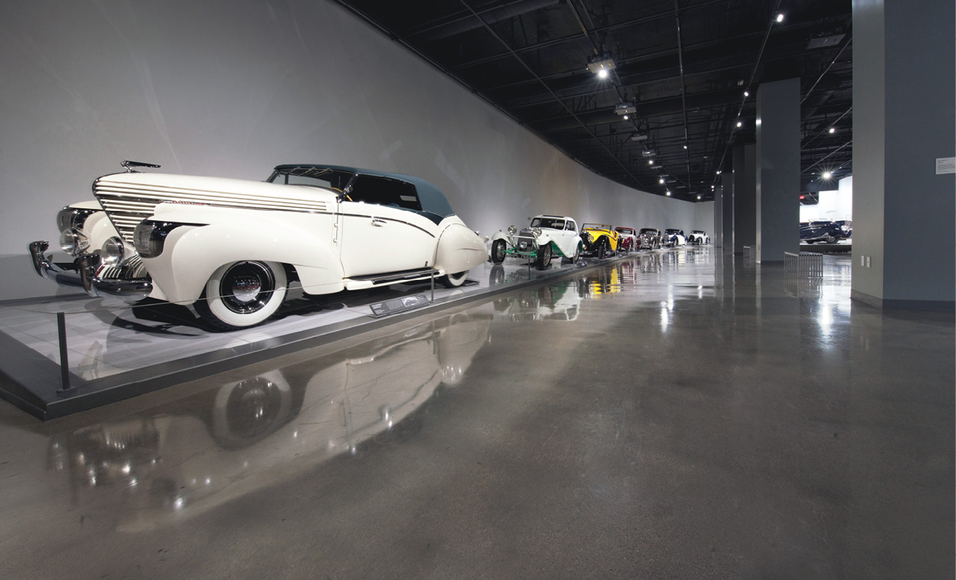 shiny grey floor with old fashioned car