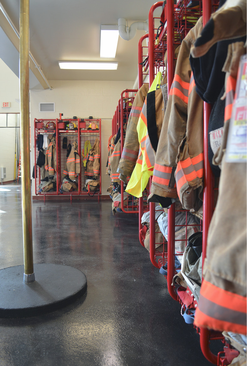 firefighter uniforms and grey floor