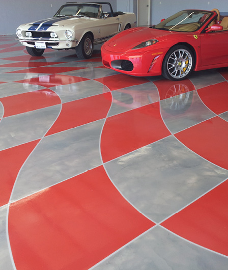 checkered floor with red car and white and blue mustang