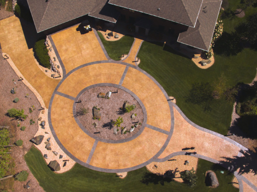 The 13,000-square-foot heated driveway and walkway, along with 25,000 square feet of unheated paving, required about 600 cubic yards of integrally colored concrete.