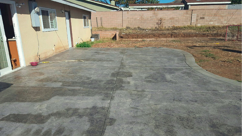 dark spots on concrete is created when a sealer is inconsistently applied with a roller