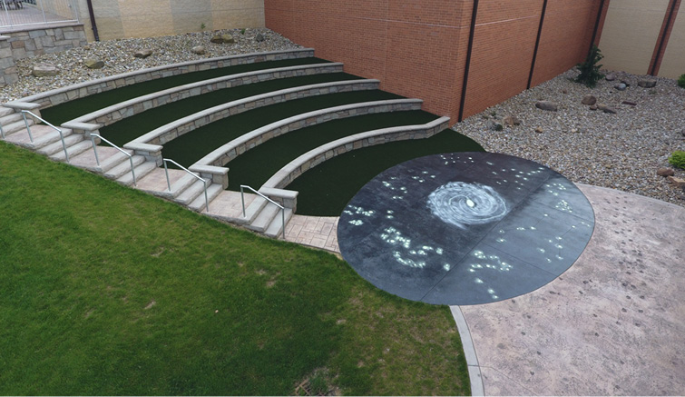 This Glow-in-the-dark Patio was at the bottom of a tiered seating area with astro-turf