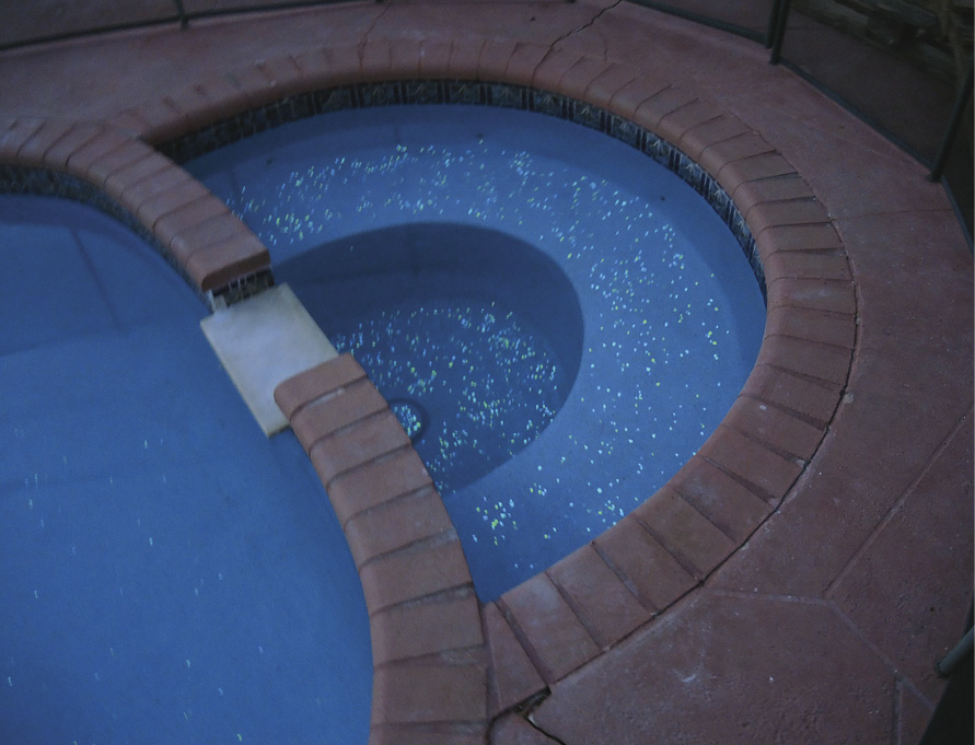 glow-in-the-dark stones in concrete at the bottom of a pool